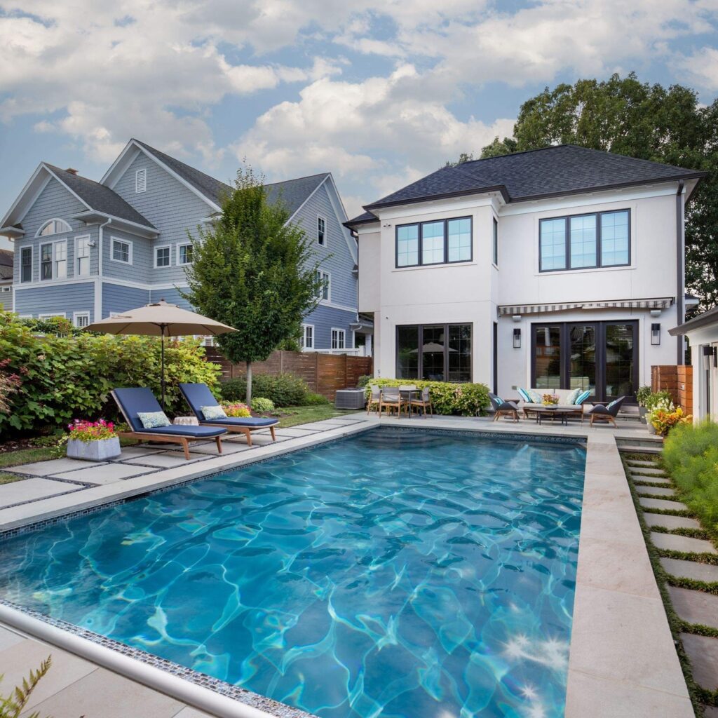 Custom swimming pool design in backyard